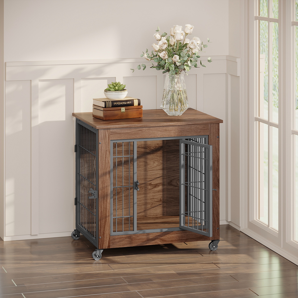 Wooden pet crate with metal doors in a room with a vase of flowers and books on top.