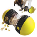 Yellow and black pet toy with food dispensing mechanism, dog interacting with it.