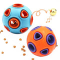 Two puzzle balls, one blue and orange, one orange and purple, with scattered treats on a white background.