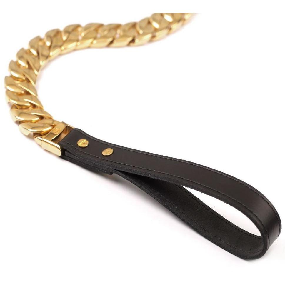 Gold chain with black leather handle on a white background
