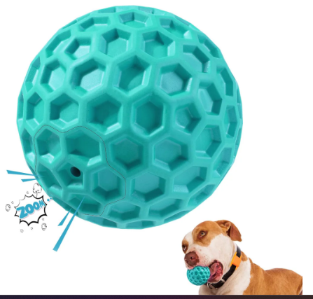 Dog playing with a blue textured ball on a white background